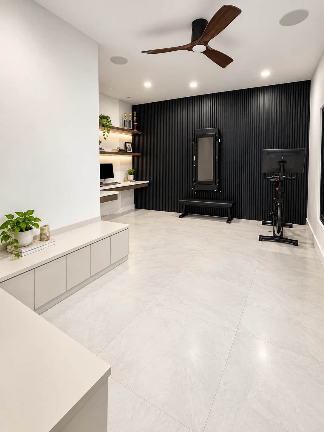 Finished basement home gym with a black slatted accent wall, a spin bike, a mirrored rack and a built-in desk nook