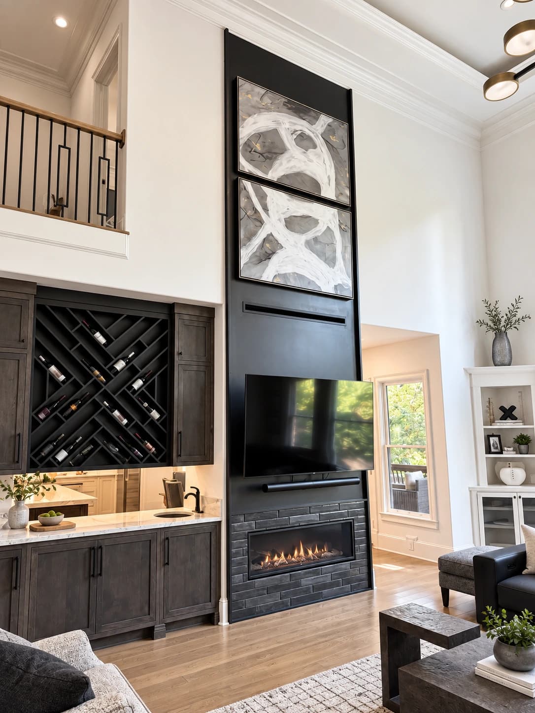 Family room addition looking up the black fireplace wall to the landing above, with a walnut wet bar and lattice wine storage alongside