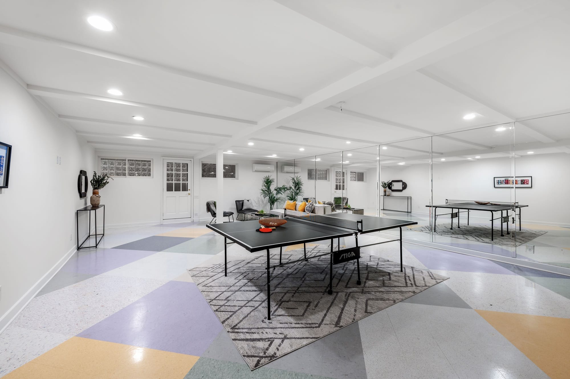 recently finished basement game room with ping pong table.